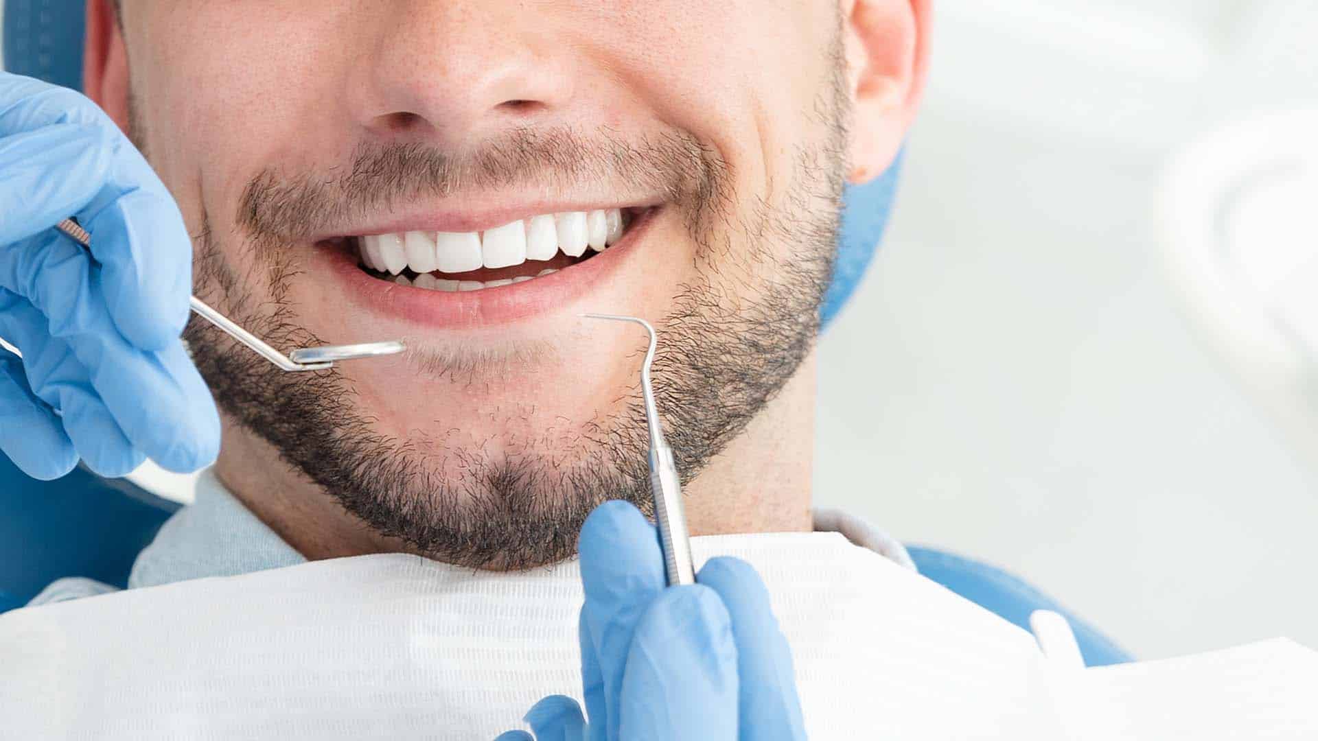 Man getting teeth cleaned in Brentwood TN at a preventative dental care appointment. 