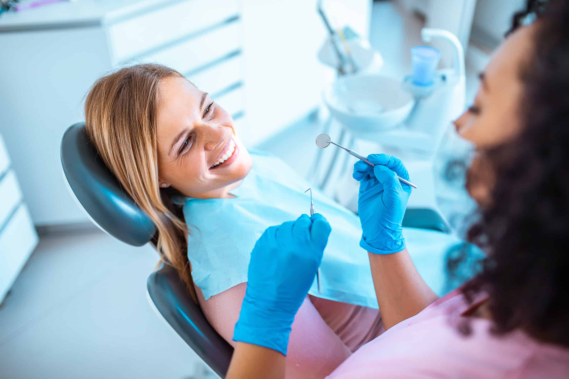 Woman getting a tooth extraction consultation near Brentwood, TN