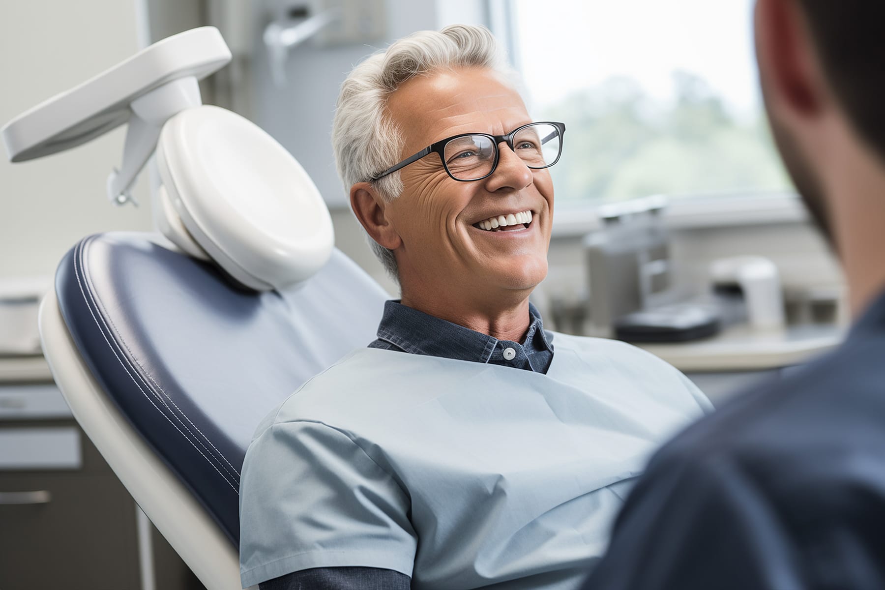 Man smiling at a cosmetic dental bonding appointment in Brentwood, TN