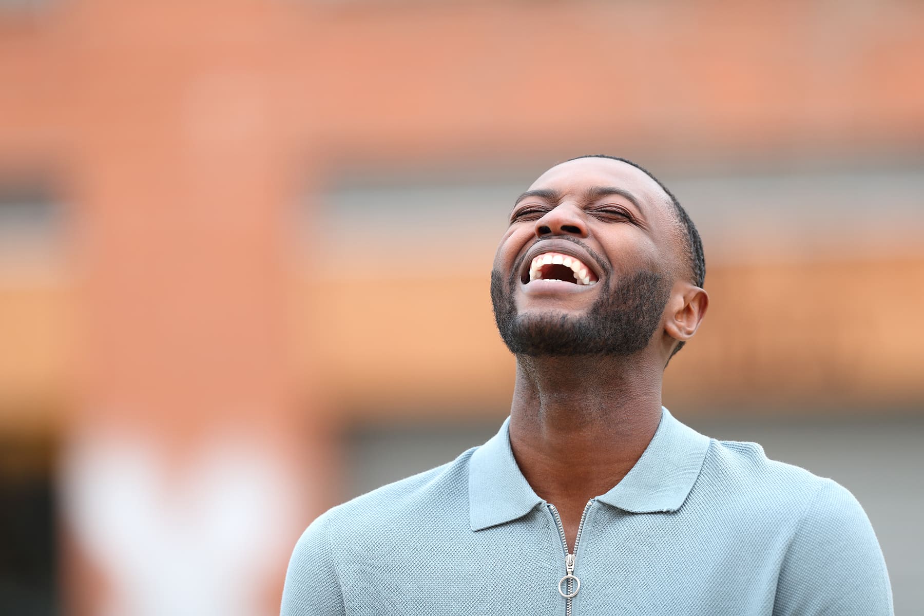 Man smiling after getting his gums cleaned in Brentwood, TN