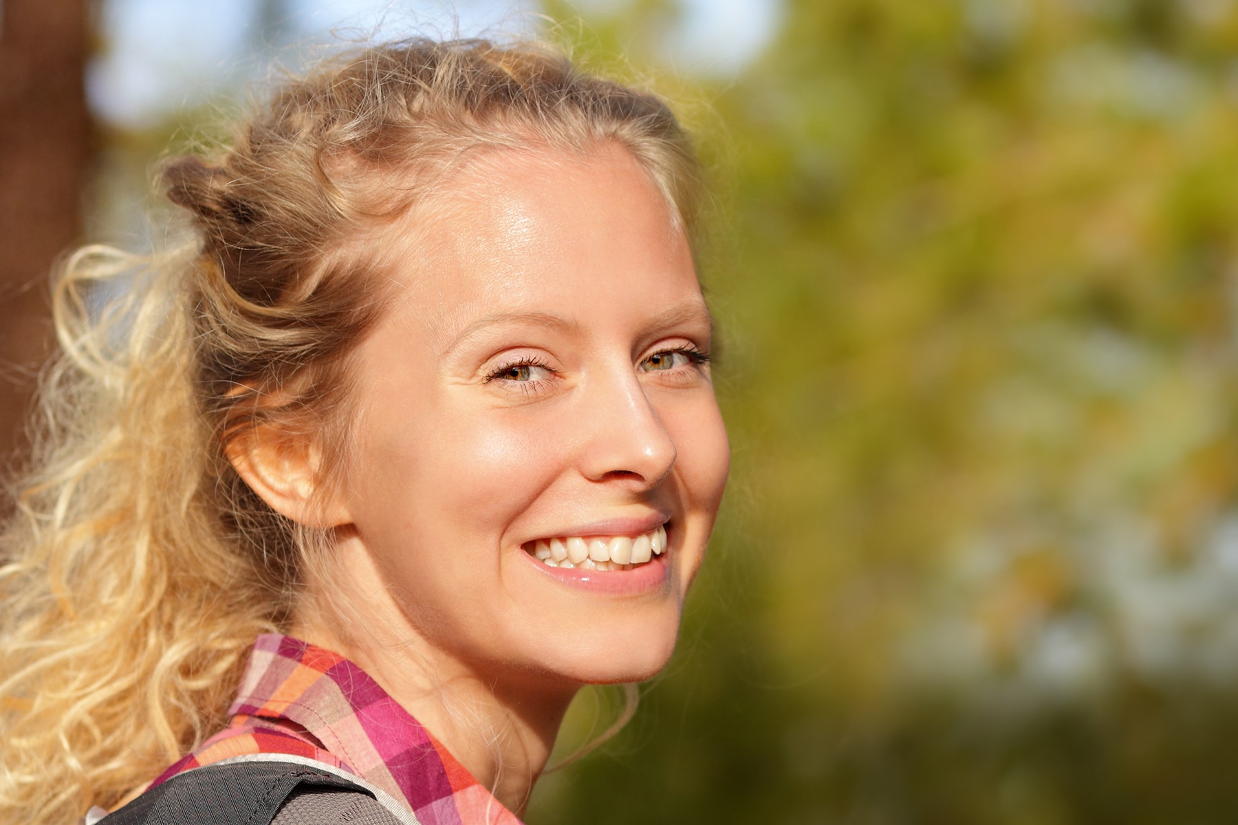 Woman smiling after getting dental sealants in Brentwood, TN